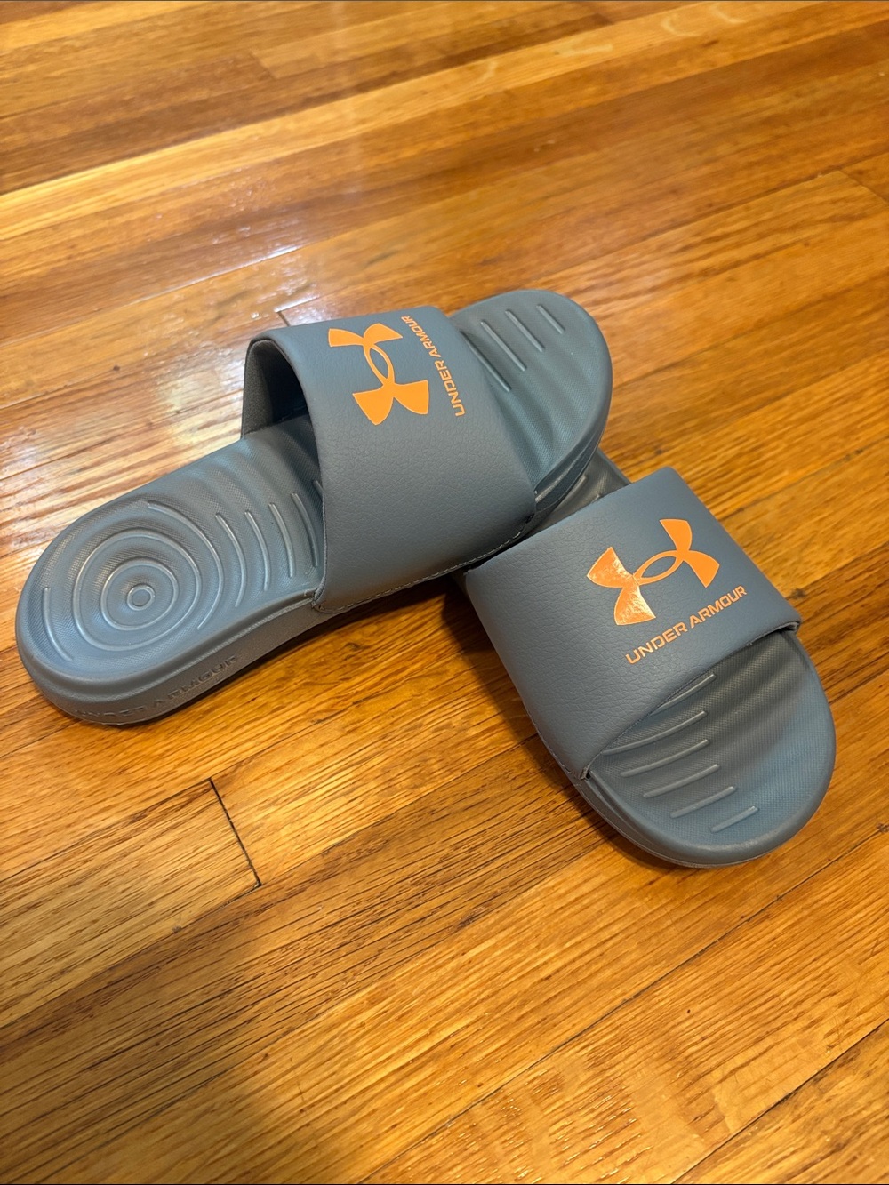 Under Armour Kids' Gray Slides with Orange Logo